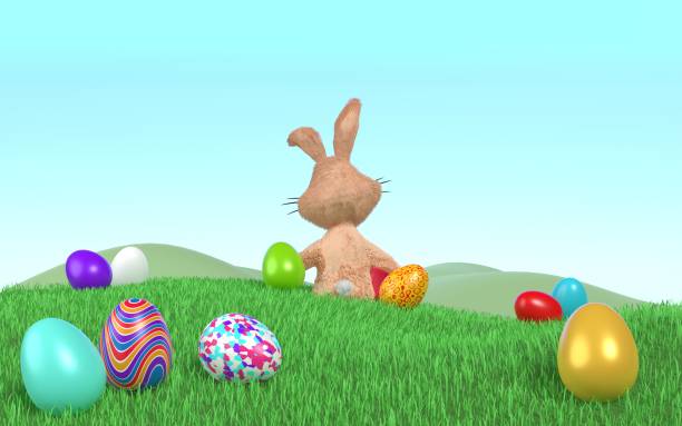 istock Decorated Easter Eggs and Easter Bunny on the Grass Against Clear Blue Sky 1373156162