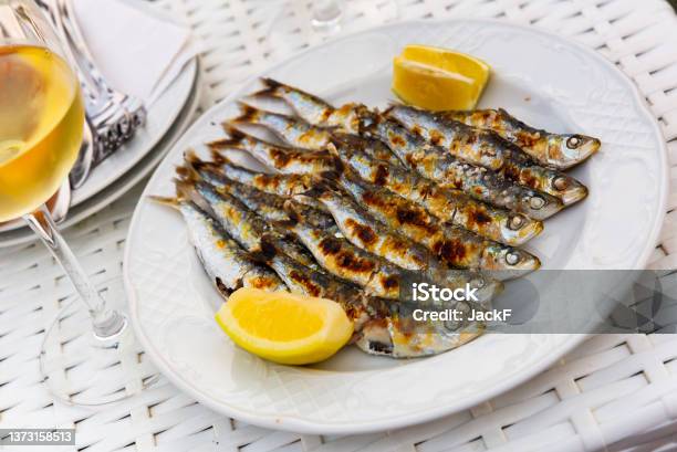 Espeto De Sardinas With Slice Of Lemon Stock Photo - Download Image Now - Sardine, Anchovy, Lemon - Fruit