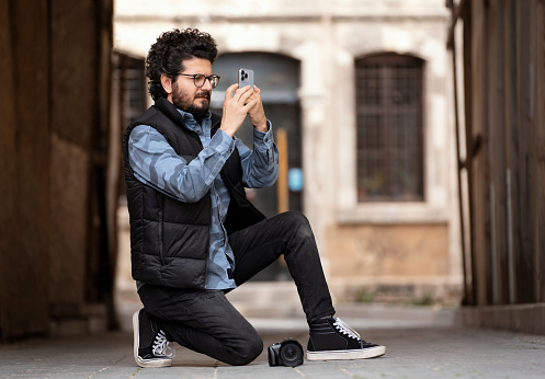 Male tourist having fun in Old Town Kaleici and taking pictures, Analya,Turkey