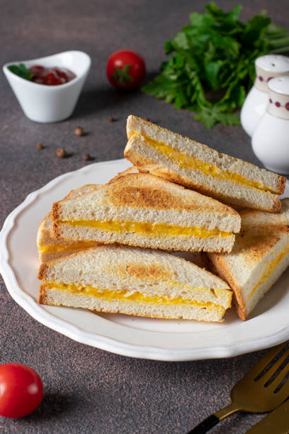 istock Sandwiches with egg and cheese fried in pan served with tomato sauce for breakfast 1373159927