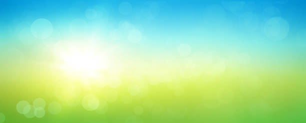 istock Fresh spring abstract background with bokeh and sun glow. Graphic element with blue and green horizontal colour gradients. 1373160945