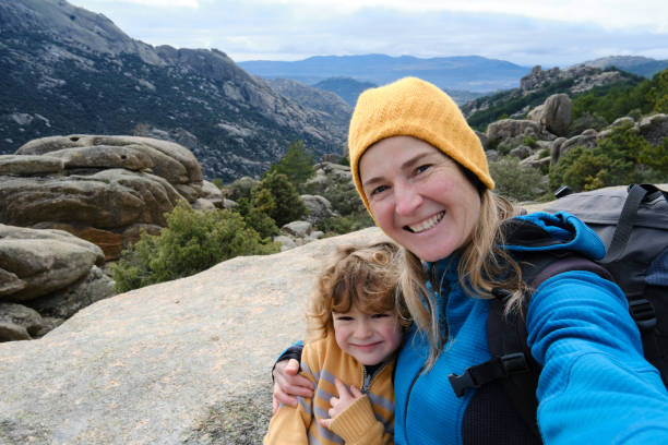 istock Mother and son taking a selfie in the mountains 1373161484