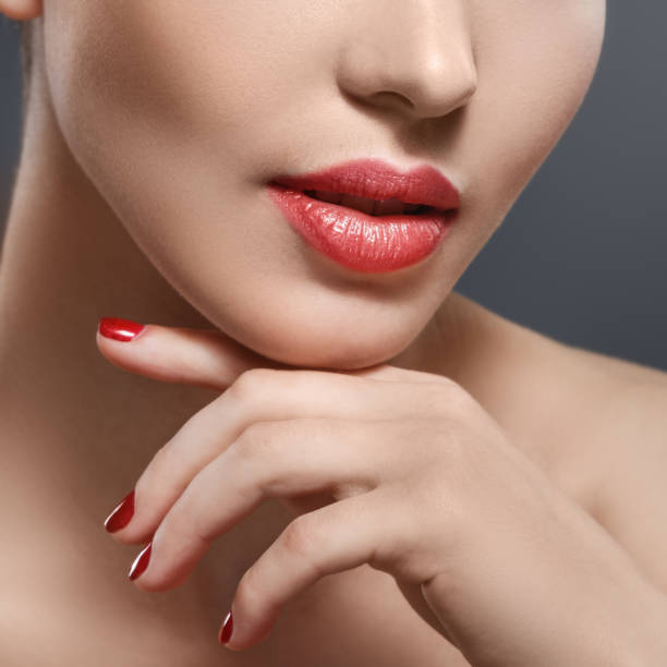 istock Part of woman face with red lips 1373161535