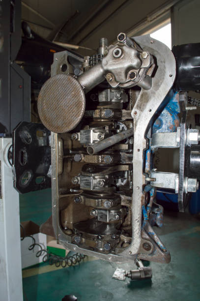 istock A car engine with a removed pallet is installed on a stand for engine repair. Vertical photo 1373162826