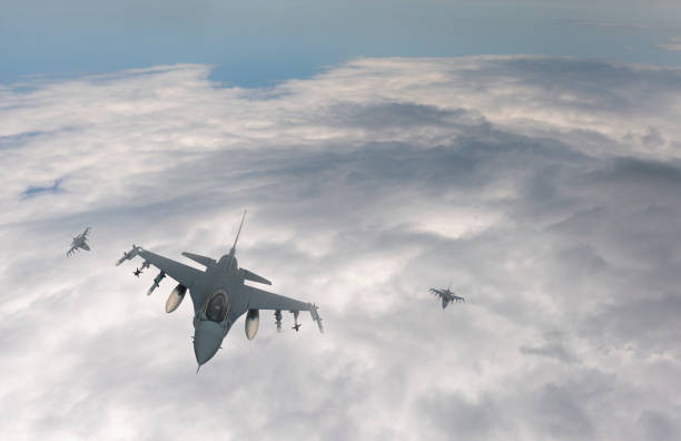 istock Jet fighters flying over the clouds. 1373162886