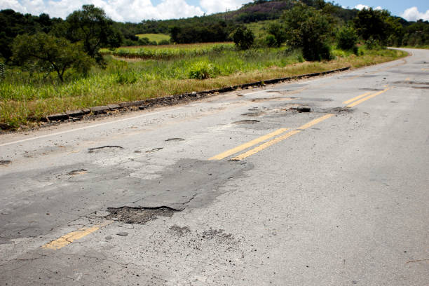 istock highway with damaged asphalt unsuitable for driving 1373165360