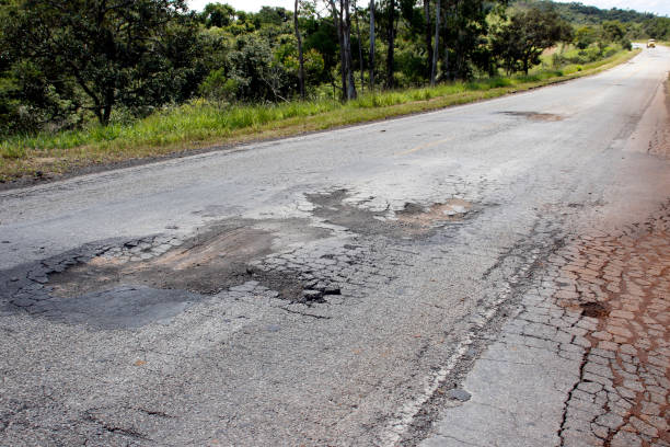 istock highway with damaged asphalt unsuitable for driving 1373165362