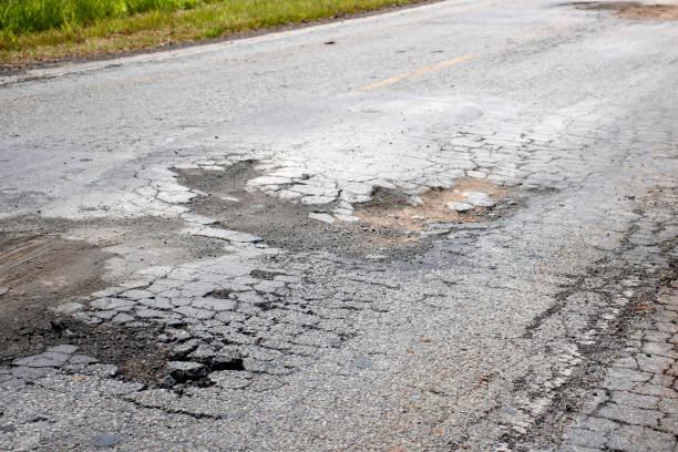 istock highway with damaged asphalt unsuitable for driving 1373165365