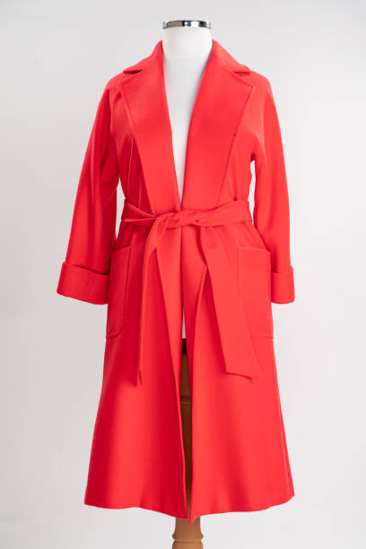 istock Cashmere women's coat isolated on white. red woolen jacket with belt. 1373165976