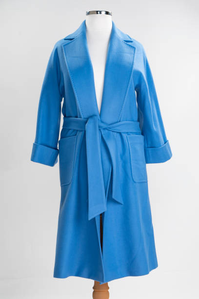 istock Cashmere women's coat isolated on white. blue woolen jacket with belt. 1373166168