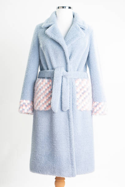 istock Cashmere women's coat isolated on white. blue woolen jacket with belt. 1373166238