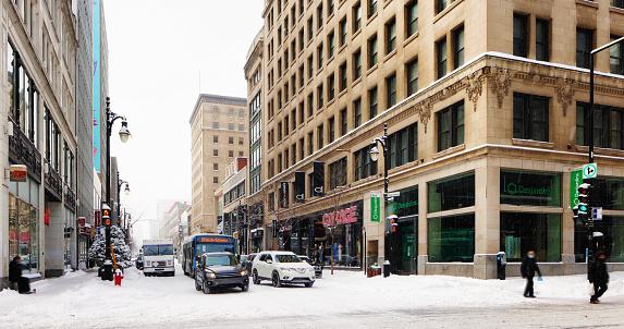 Montreal Saint-Catherine shopping street in urban Winter scene.