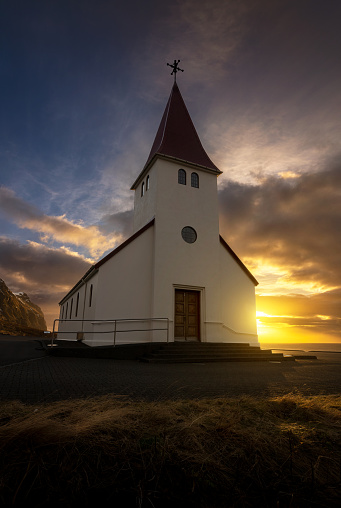 View of the famous icelandic church at sunrise in Vik y Myrdal, Iceland