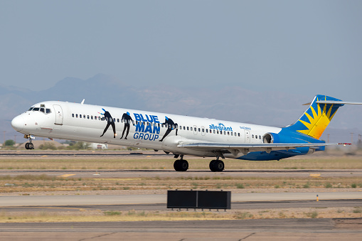 Phoenix, Arizona, USA - May 13, 2013: Allegiant Air McDonnell Douglas MD-83 (DC-9-83) aircraft in a promotional Blue Man Group livery taking off from Phoenix-Mesa Gateway airport in Arizona.