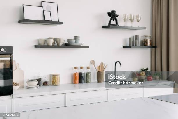Modern Kitchen In Whine Tones With Appliances And Decor Stock Photo - Download Image Now
