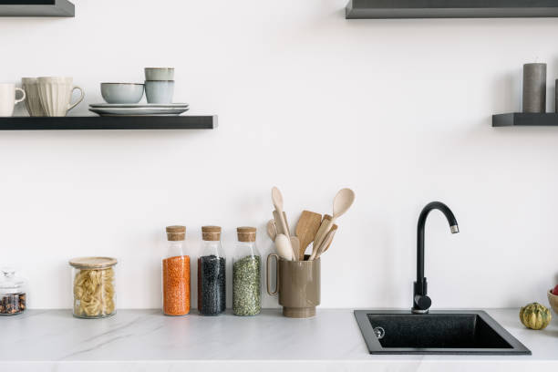 istock Nordic style modern kitchen interior design with sink and decor 1373176825