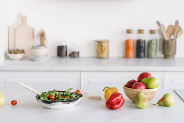 istock Preparing healthy salad in white modern kitchen 1373176827