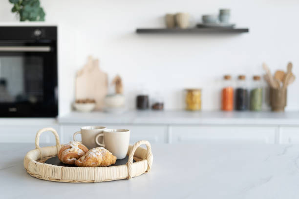 istock Homemade croissants and cups in modern kitchen 1373176839