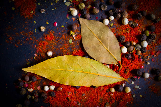 spices turmeric, pepper in on a dark background