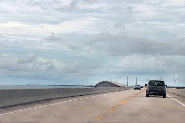 Vehicles Meet on Florida Keys Seven Mile Bridge at Overpass Under Sky Blue Cloudscapes