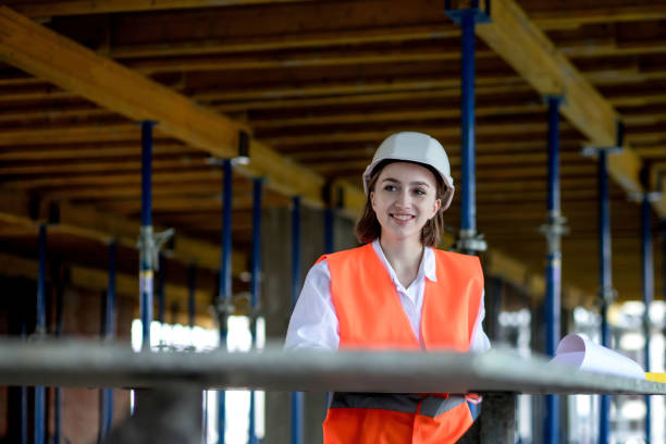 istock Architect or engineer working, browsing building project indoor of construction site with blueprint plan 1373180420