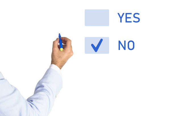 istock Choice No. Thinking young man making decision yes, no or maybe 1373187889