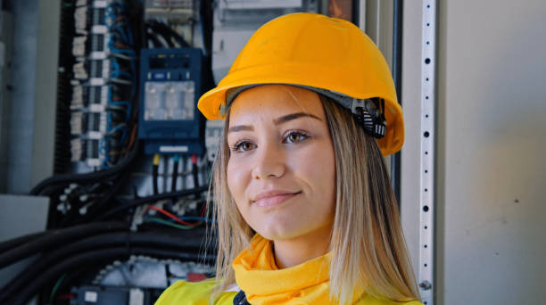 istock Female engineer working in solar power plant. Renewable energy systems. Solar city. 1373189914