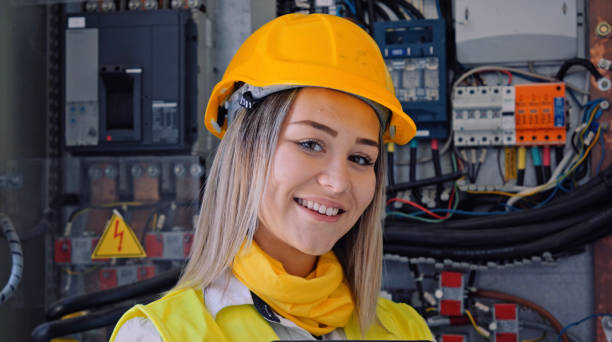 istock Female engineer working in solar power plant. Renewable energy systems. Solar city. 1373189918