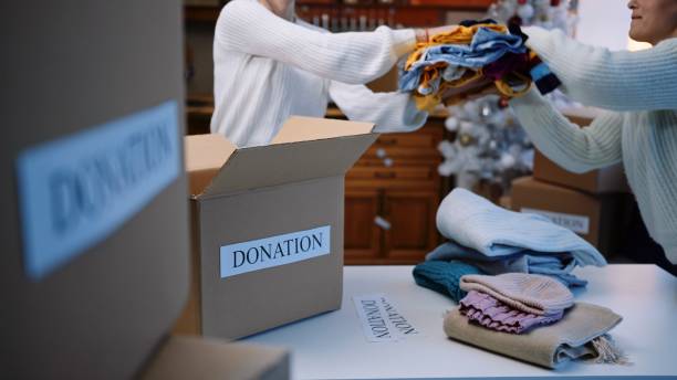 istock Preparing donation boxes during the winter holidays. Christmas charity. 1373190000