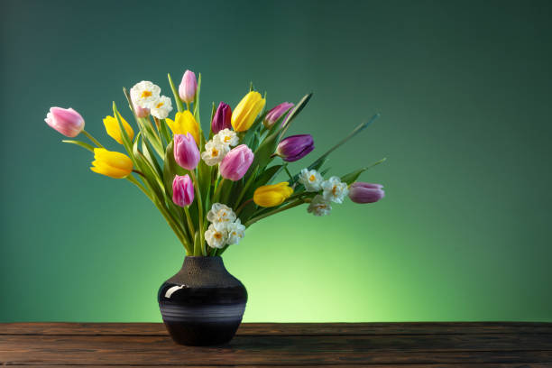 istock spring flowers in  ceramic vase on wooden table 1373190508