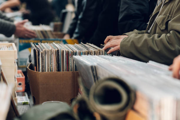 istock Man hands browsing vinyl album in a record store 1373190930