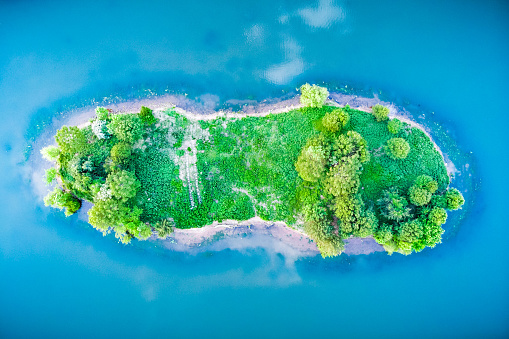 An inviting little island that looks like a footprint or a sandal
