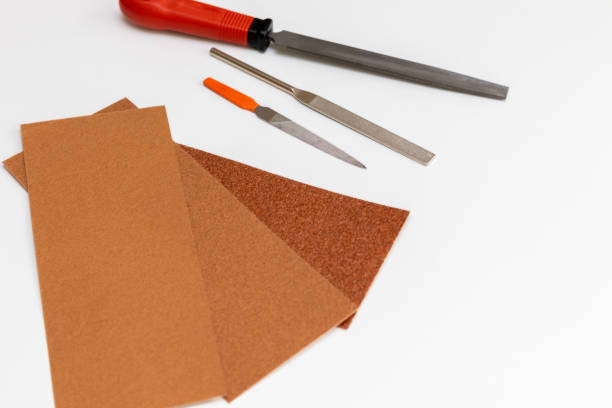 istock Iron files and sandpapers on the white table 1373202072
