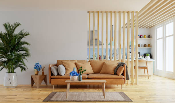 istock Living room interior wall mockup in warm tones with leather sofa which is behind the kitchen. 1373204298