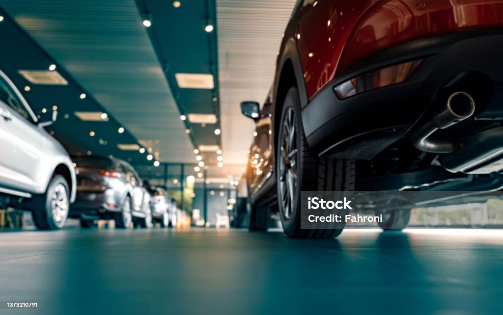 Rearview of parked cars Rearview of parked cars Car dealership office. New car parked in modern showroom. Automobile leasing and insurance concept. Car Stock Photo