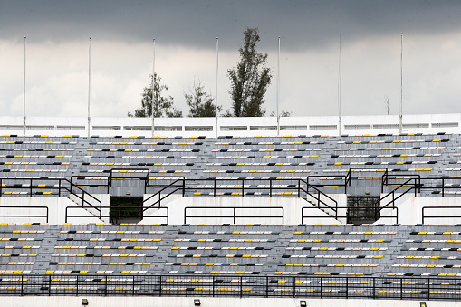 Empty track and field stadium seat.