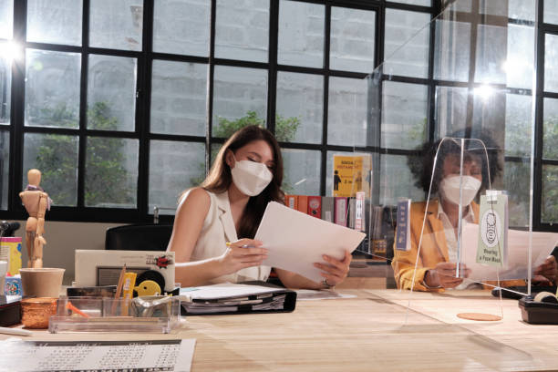Business working with a new normal, covid-19 protection office workplace. stock photo