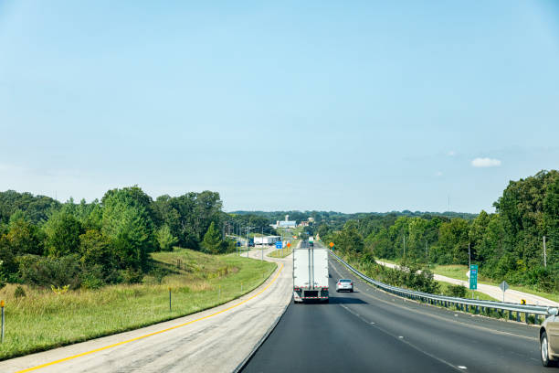 Highway view from a windshield of a car.