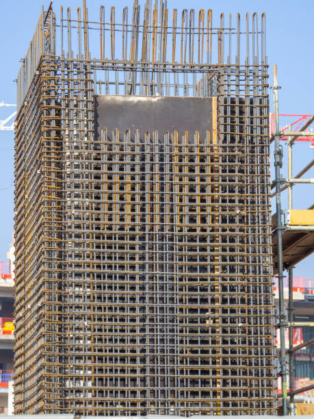 istock Rebars bars for concrete wall construction of a new building. Construction site. Iron structure ready to be cast with concrete. Steel bars construction for concreting. Brand new armature 1373230874