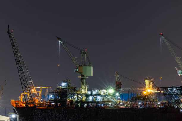 Ship Maintenance in Dry Dock at Night long exposures shot and the sea foreground