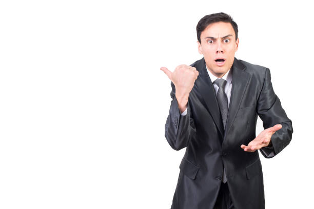 istock Shocked man pointing aside with surprise and astonishment 1373231071