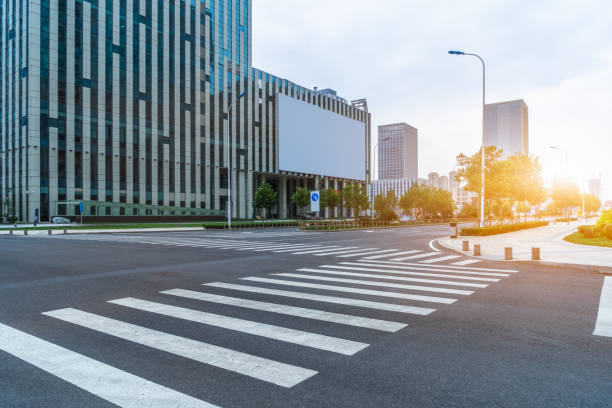 istock empty road with zebra crossing and skyscrapers in modern city 1373231948