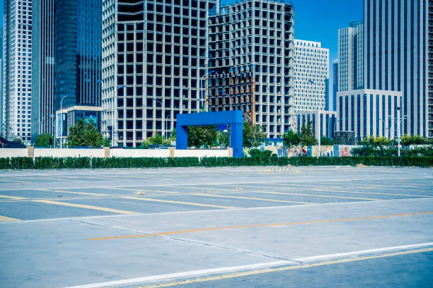 istock Empty car park with downtown city space background 1373231955