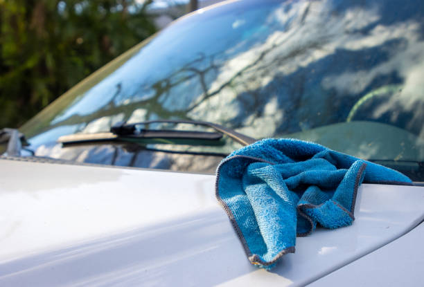 istock Car detailing rag on hood 1373232010
