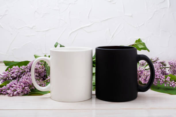 istock White and black mug mockup with lilac bouquet 1373232051