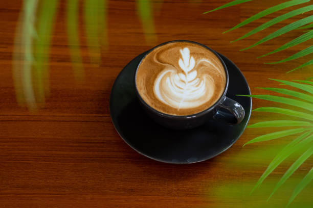 istock hot latte art coffee on wood table, relax time 1373235523