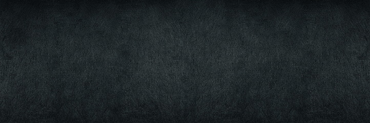 Black shale wide panoramic texture. Dark grey gloomy grunge abstract widescreen banner background