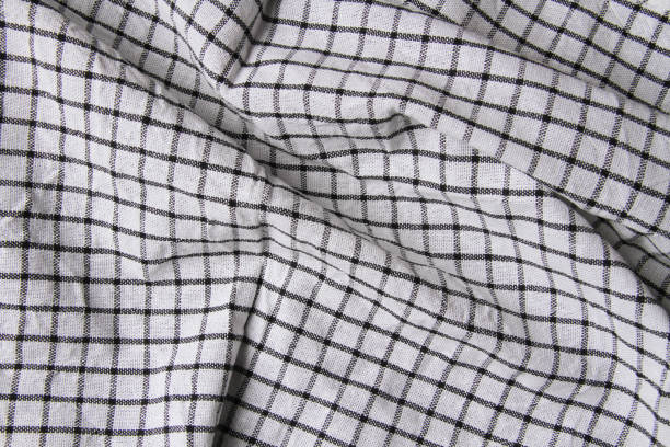 istock Plaid material. Towel on the table. Wrinkled fabric with stripes. 1373236232
