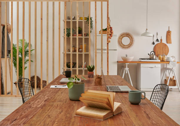 istock Decorative kitchen close up concept with table, dishwasher and refrigerator background style. 1373236330