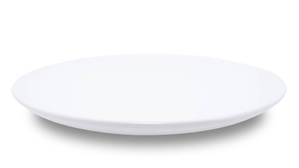 istock White circle ceramics plate isolated on white background. 1373237960
